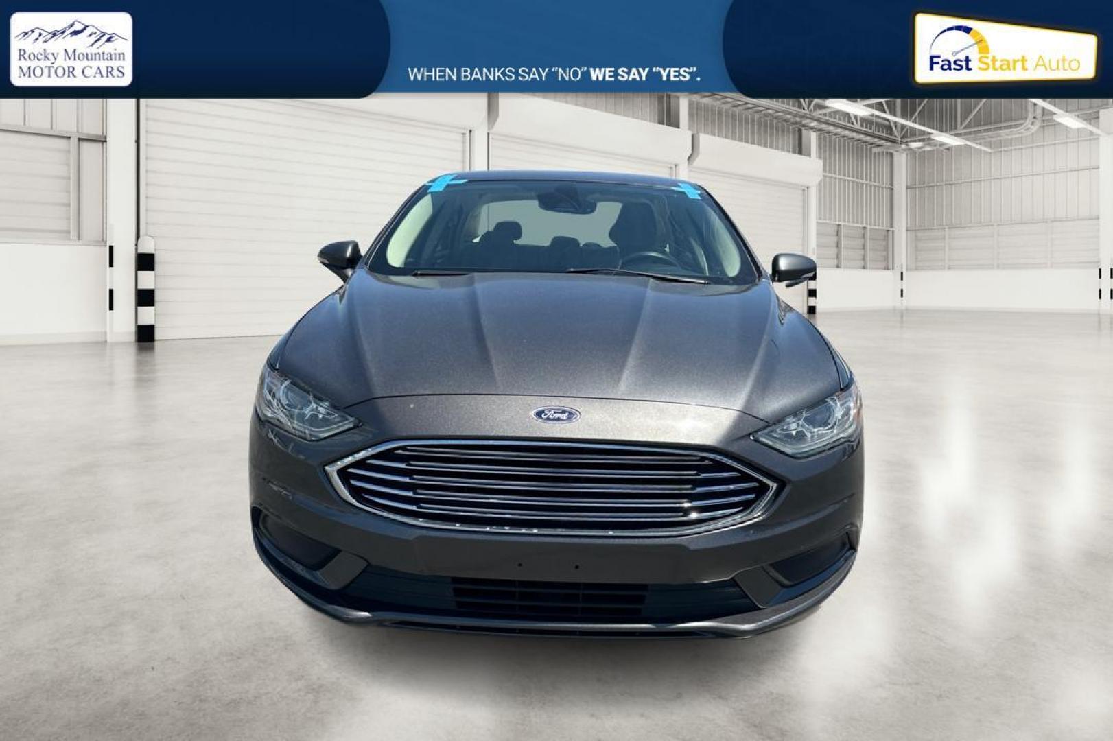 2018 Gray Ford Fusion SE (3FA6P0HD7JR) with an 1.5L L4 DOHC 16V engine, 6A transmission, located at 7755 State Street, Midvale, UT, 84047, (801) 753-9063, 40.610329, -111.890656 - Photo#7