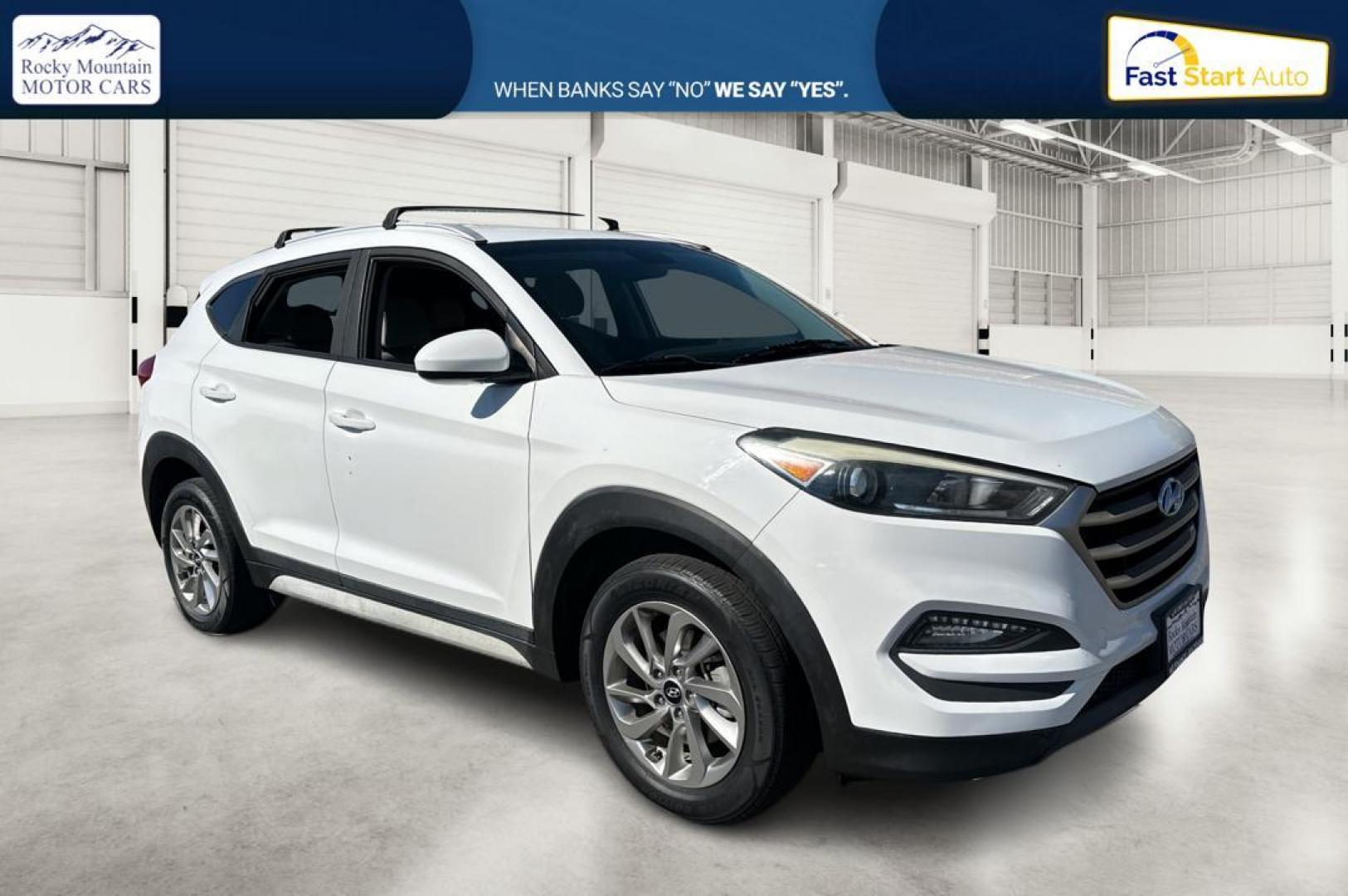 2018 White Hyundai Tucson SE (KM8J33A46JU) with an 2.0L L4 DOHC 16V engine, 6A transmission, located at 344 S Washington Blvd, Ogden, UT, 84404, (801) 399-1799, 41.255482, -111.970848 - Photo#0