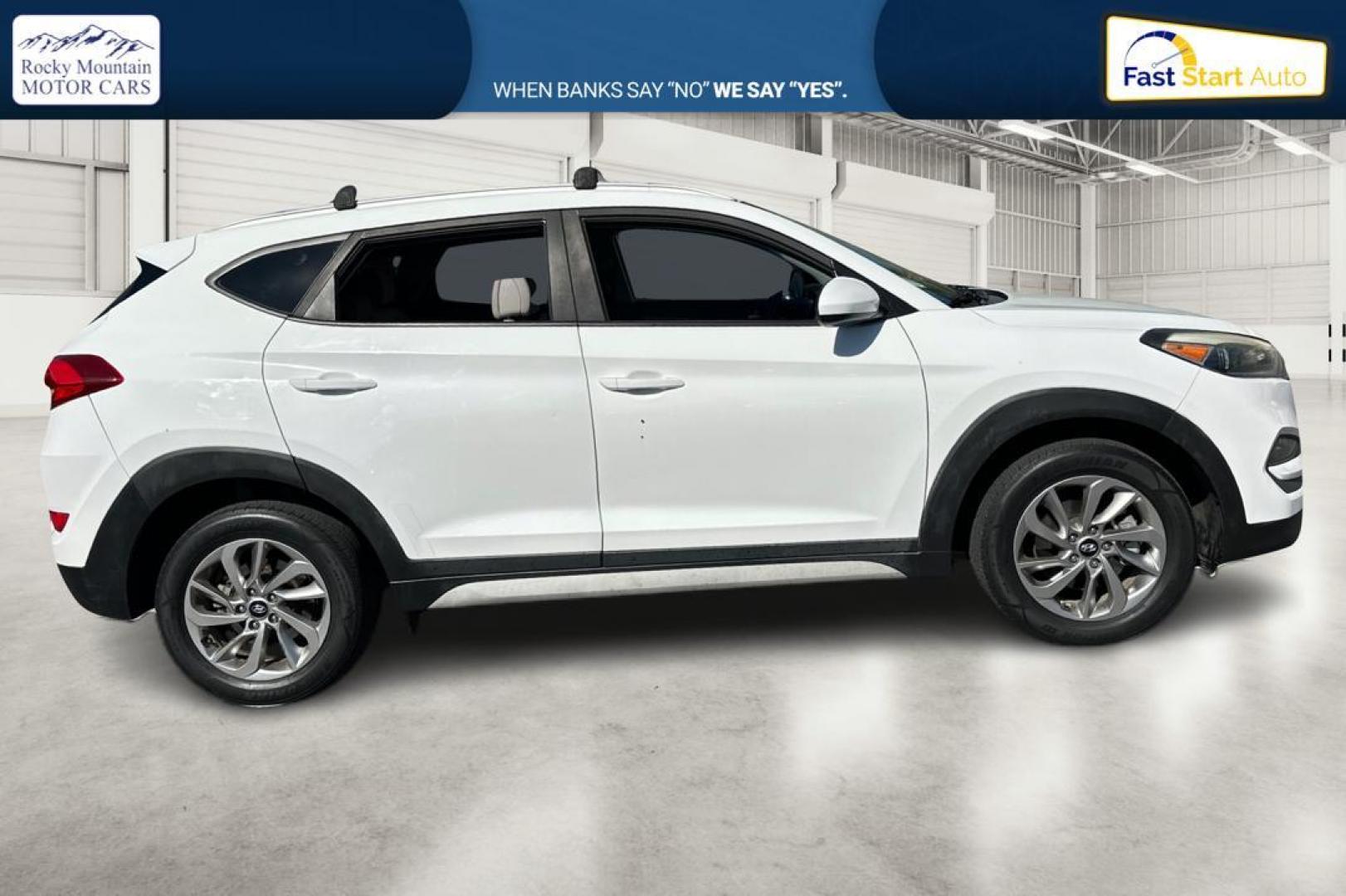 2018 White Hyundai Tucson SE (KM8J33A46JU) with an 2.0L L4 DOHC 16V engine, 6A transmission, located at 344 S Washington Blvd, Ogden, UT, 84404, (801) 399-1799, 41.255482, -111.970848 - Photo#1