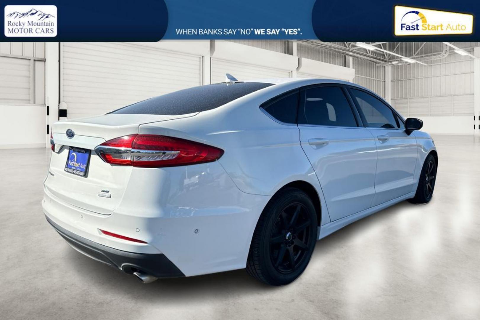 2019 White Ford Fusion SE (3FA6P0HD1KR) with an 1.5L L4 DOHC 16V engine, 6A transmission, located at 7755 State Street, Midvale, UT, 84047, (801) 753-9063, 40.610329, -111.890656 - Photo#2