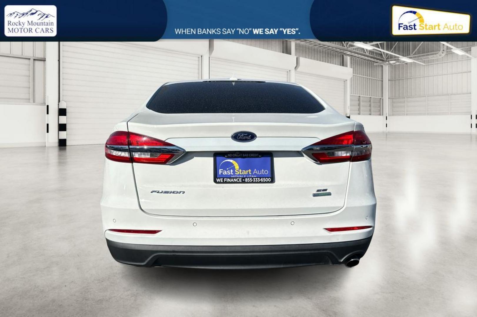 2019 White Ford Fusion SE (3FA6P0HD1KR) with an 1.5L L4 DOHC 16V engine, 6A transmission, located at 7755 State Street, Midvale, UT, 84047, (801) 753-9063, 40.610329, -111.890656 - Photo#4