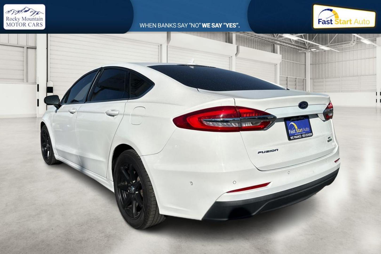 2019 White Ford Fusion SE (3FA6P0HD1KR) with an 1.5L L4 DOHC 16V engine, 6A transmission, located at 7755 State Street, Midvale, UT, 84047, (801) 753-9063, 40.610329, -111.890656 - Photo#5